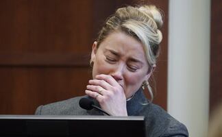 Amber Heard dice que por culpa de Johnny Depp acortaron su papel en "Aquaman"