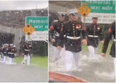 Marines uniformados ayudan a mujer varada por lluvias en EU