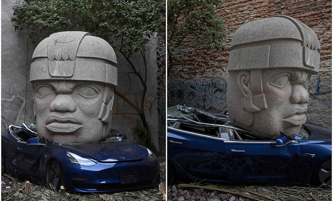 Artista mexicano busca 'provocar' a Elon Musk y aplasta un Tesla con colosal cabeza olmeca (Photo by CARL DE SOUZA / AFP)