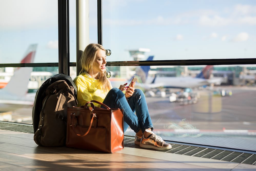 Woman sitting in airport. iStock