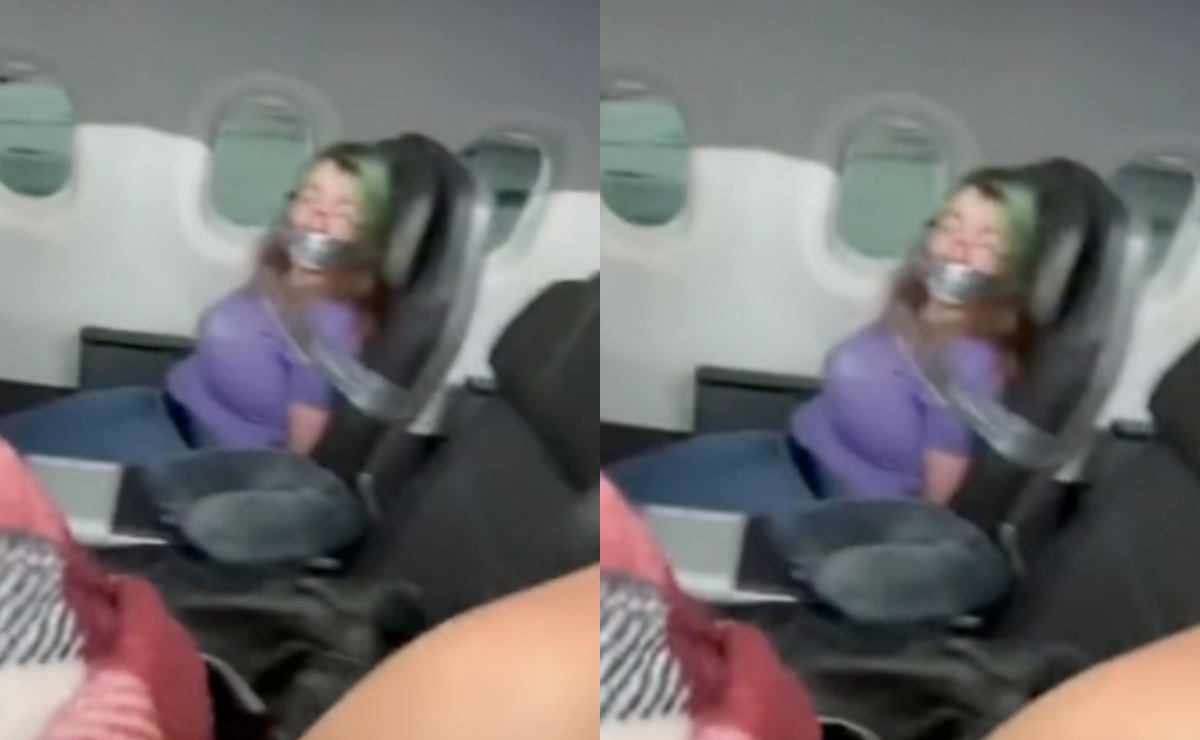 Inmovilizan a mujer con cinta por intentar abrir puerta de avión en pleno vuelo